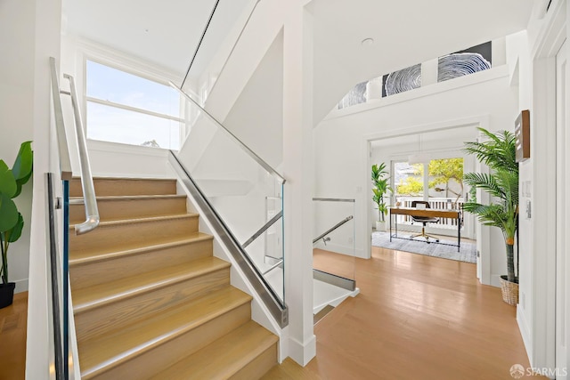 staircase featuring wood finished floors