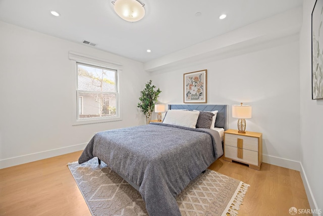 bedroom with recessed lighting, light wood-type flooring, visible vents, and baseboards