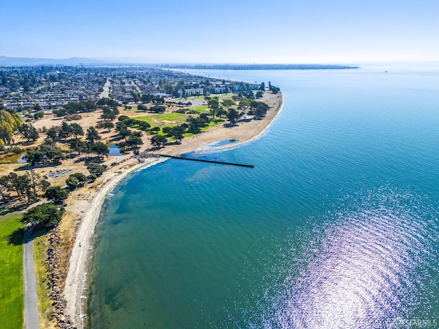 birds eye view of property with a view of the beach and a water view