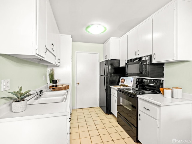 kitchen with light tile patterned floors, sink, white cabinetry, and black appliances