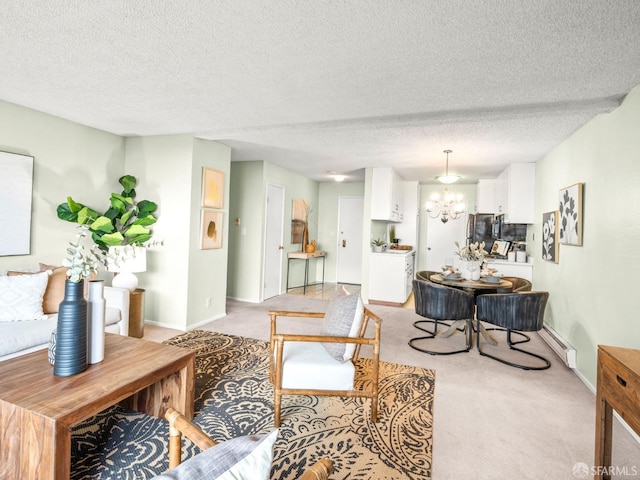 carpeted living room with a notable chandelier, a textured ceiling, and a baseboard radiator