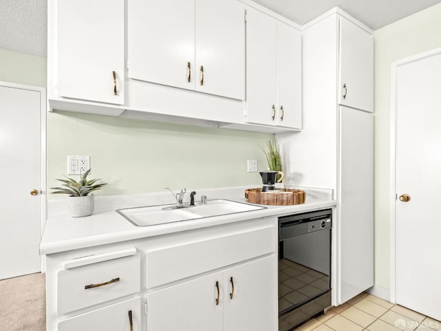 kitchen with white cabinetry, sink, a textured ceiling, and black dishwasher