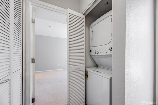8100 Oceanview Ter Unit 117, San Francisco, CA 94132 - laundry room with stacked washer and clothes dryer, carpet, and baseboards