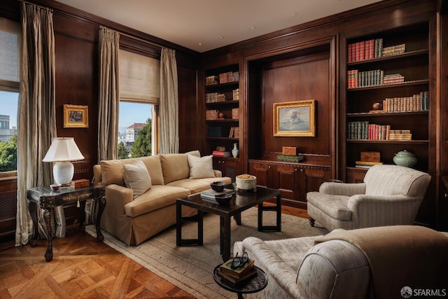 sitting room with built in features and light parquet flooring