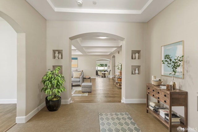42119 Vinha Way, Fremont, CA 94539 - hall with arched walkways, a tray ceiling, tile patterned floors, and baseboards