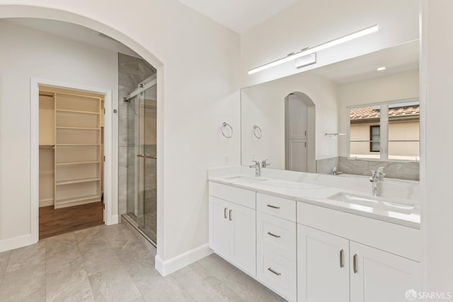 42119 Vinha Way, Fremont, CA 94539 - full bath with double vanity, a stall shower, baseboards, and a spacious closet