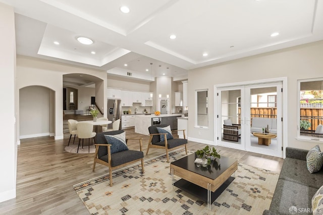 42119 Vinha Way, Fremont, CA 94539 - living room featuring arched walkways, light wood finished floors, baseboards, and recessed lighting