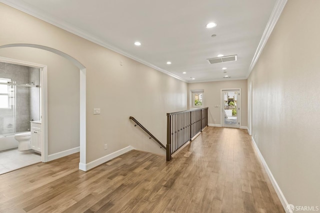 42119 Vinha Way, Fremont, CA 94539 - empty room with healthy amount of natural light, crown molding, arched walkways, recessed lighting, and light wood-style flooring