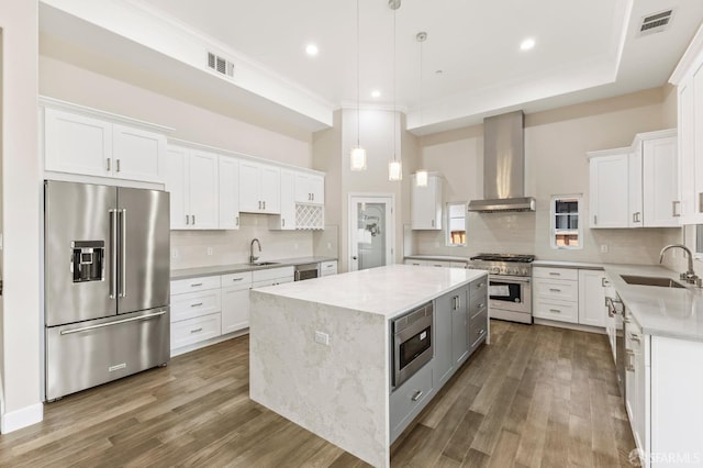 42119 Vinha Way, Fremont, CA 94539 - kitchen featuring premium appliances, wall chimney range hood, a sink, a kitchen island, and crown molding