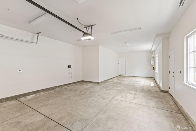 42119 Vinha Way, Fremont, CA 94539 - garage with baseboards and a garage door opener