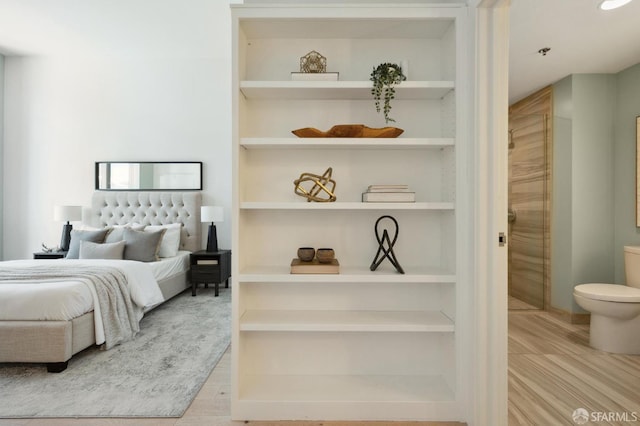 bedroom with light hardwood / wood-style flooring