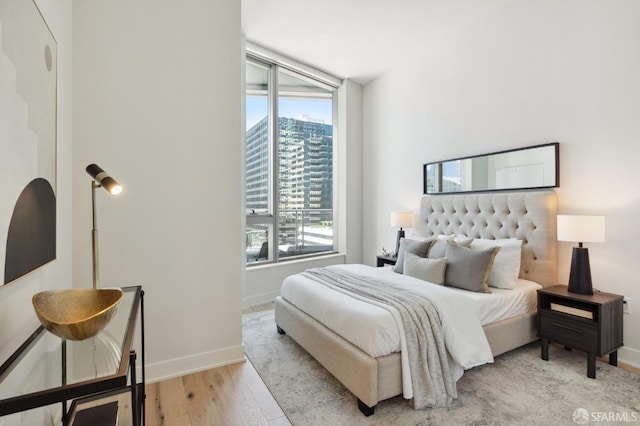 bedroom featuring light wood-type flooring