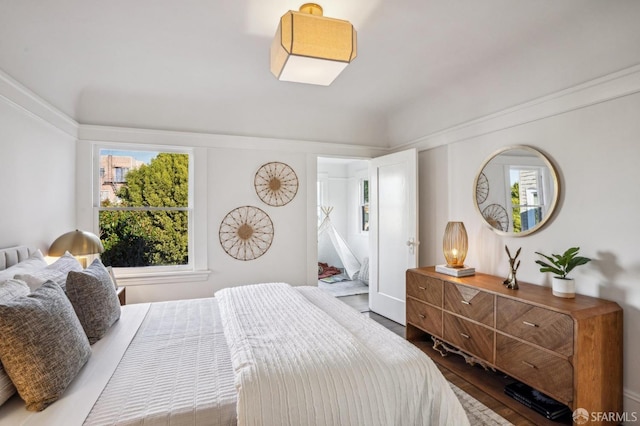 bedroom with wood finished floors