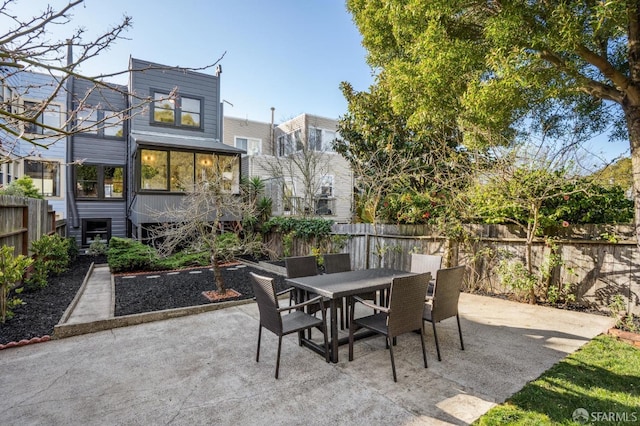 view of patio / terrace with outdoor dining area and a fenced backyard