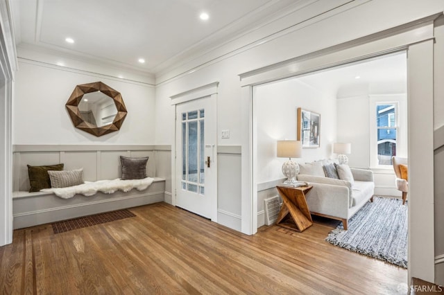 interior space featuring ornamental molding, recessed lighting, and wood finished floors