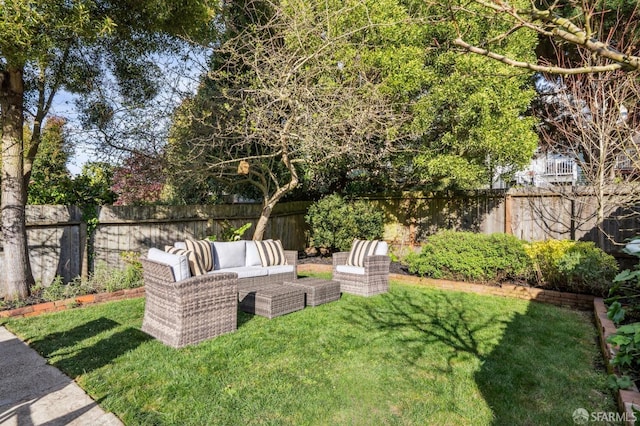 view of yard featuring an outdoor hangout area and a fenced backyard