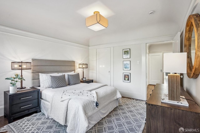 bedroom with wood finished floors