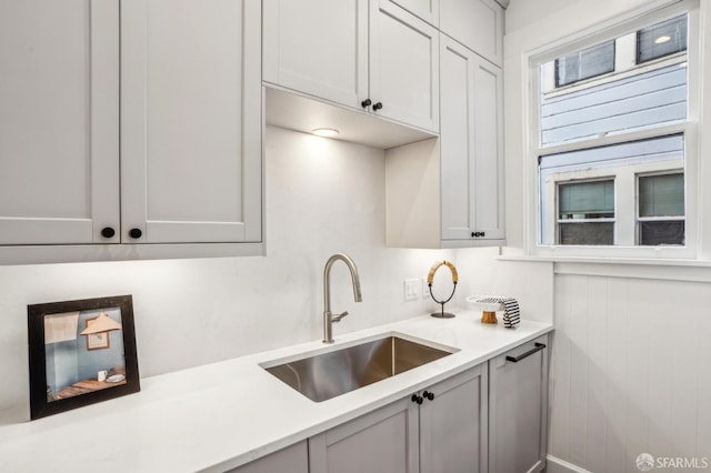 kitchen with light countertops and a sink