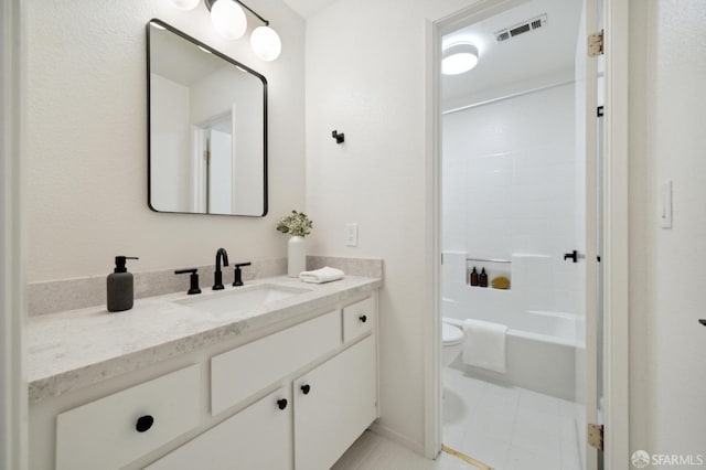 full bathroom with toilet, vanity, and  shower combination