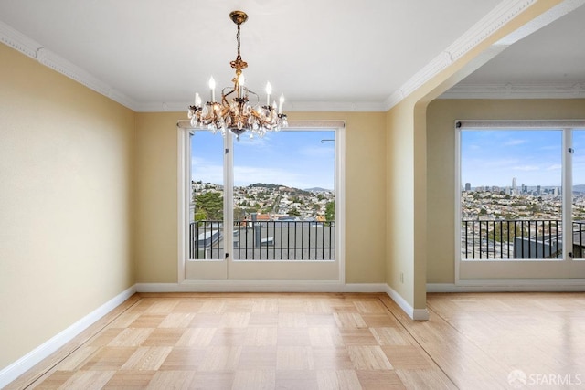 unfurnished dining area with crown molding and a notable chandelier