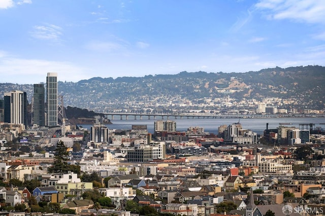 view of city with a water and mountain view