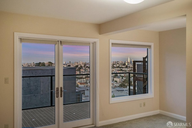 doorway to outside with french doors and carpet