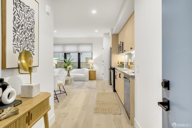 kitchen featuring stainless steel appliances and light wood-type flooring