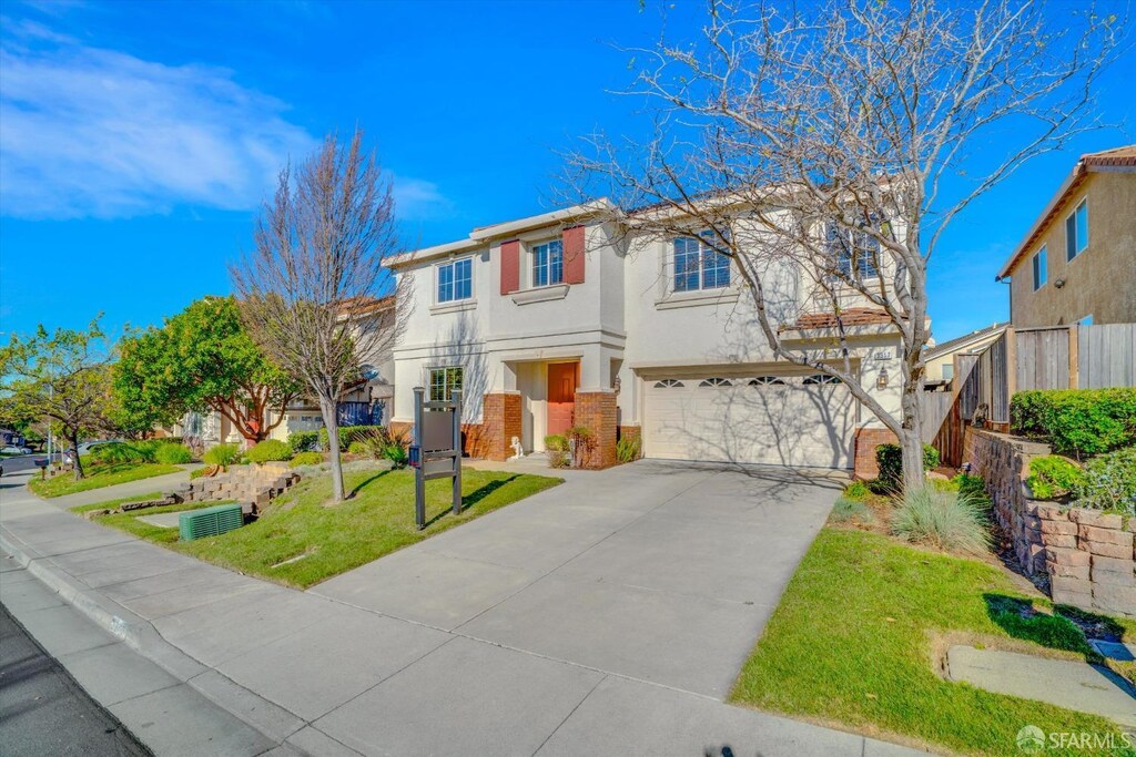 3317 Park Ridge Dr, Richmond, CA 94806 - view of front facade with a garage and a front yard