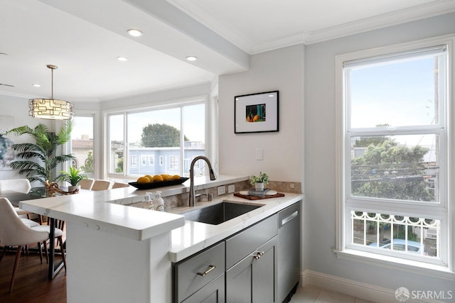 kitchen with healthy amount of natural light, stainless steel dishwasher, a sink, ornamental molding, and light stone counters