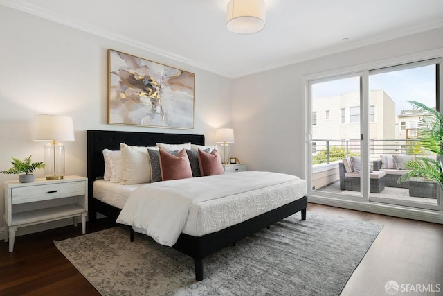 bedroom with wood finished floors, access to exterior, and crown molding