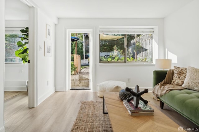 entryway featuring light wood-style flooring and baseboards