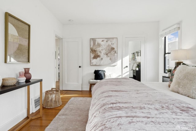 bedroom featuring wood finished floors