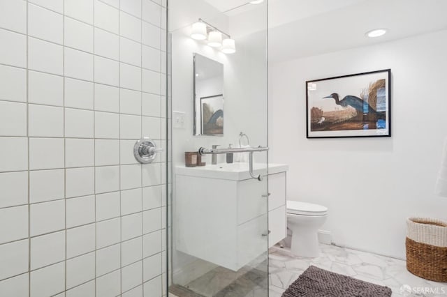 full bathroom with toilet, marble finish floor, tiled shower, and vanity