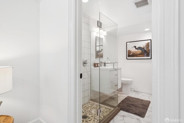 bathroom with toilet, marble finish floor, a shower stall, and visible vents