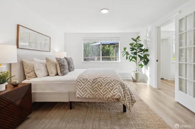 bedroom with wood finished floors