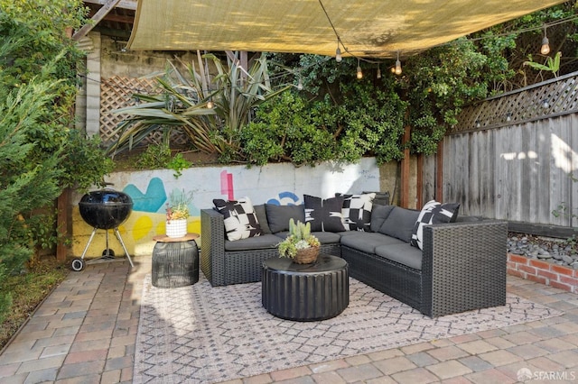 view of patio featuring an outdoor hangout area and a fenced backyard