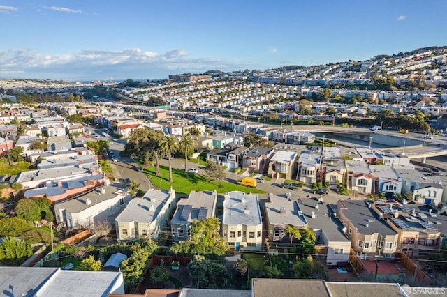 birds eye view of property with a residential view