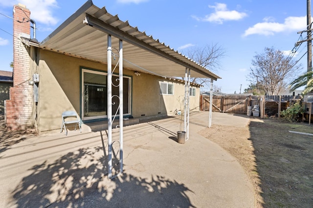 back of property featuring a patio