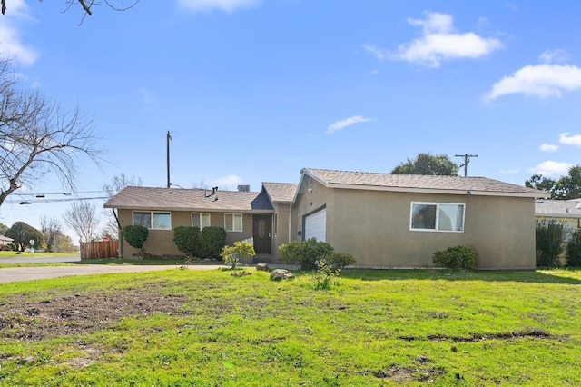 single story home featuring a garage and a front lawn