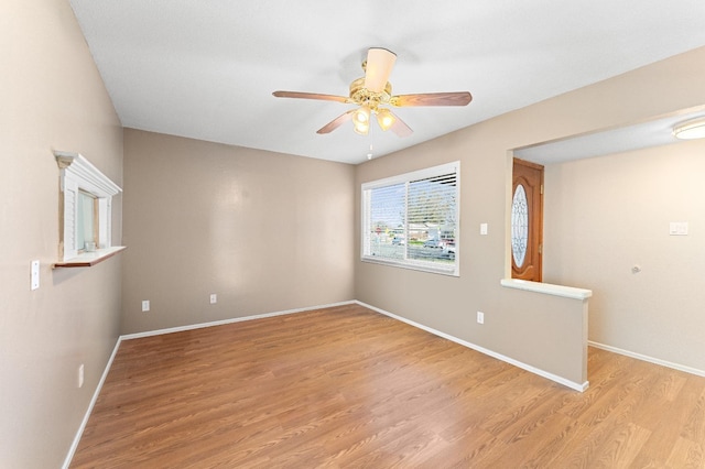 spare room with light hardwood / wood-style flooring and ceiling fan