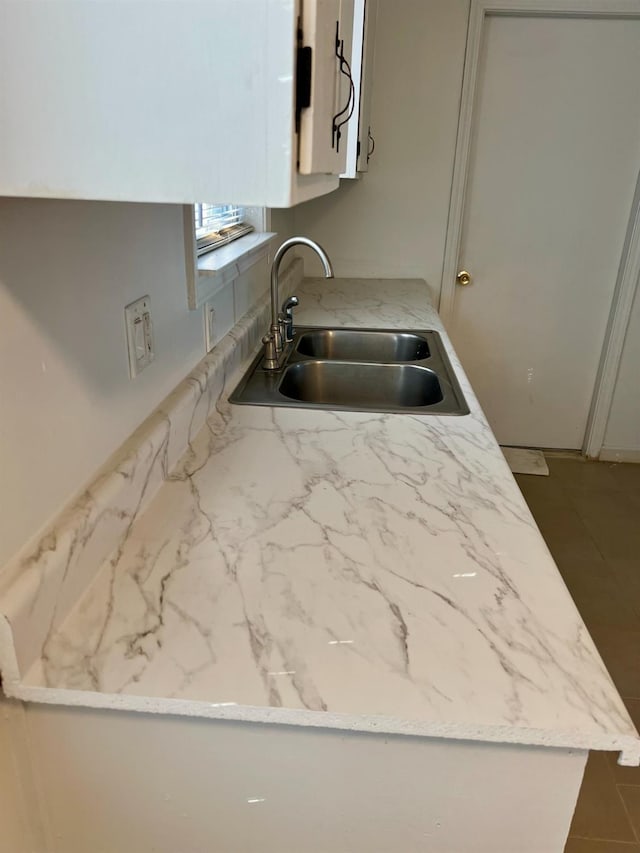 kitchen with sink and white cabinets