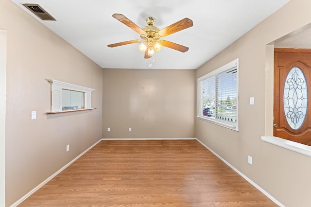 unfurnished room with ceiling fan and light hardwood / wood-style floors