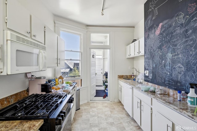 157-167 Vicksburg St, San Francisco, CA 94114 - kitchen featuring white appliances, a sink, white cabinetry, and light stone counters