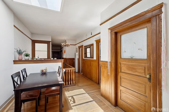 157-167 Vicksburg St, San Francisco, CA 94114 - dining space with a chandelier, wainscoting, and light wood-type flooring
