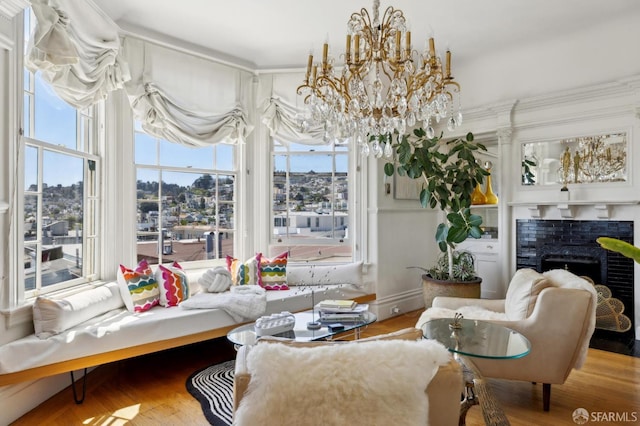 157-167 Vicksburg St, San Francisco, CA 94114 - living area featuring plenty of natural light, a chandelier, a fireplace, and wood finished floors