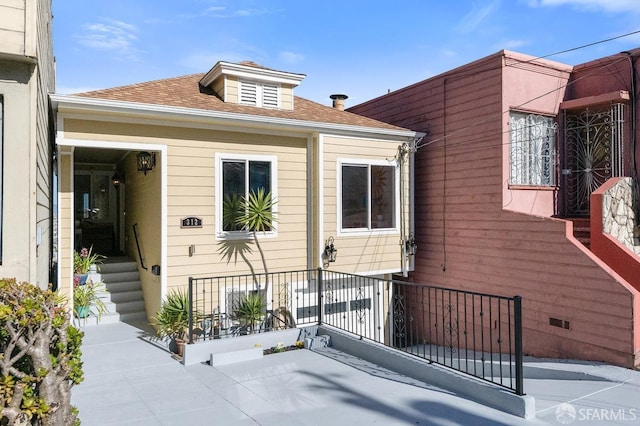 exterior space with a shingled roof