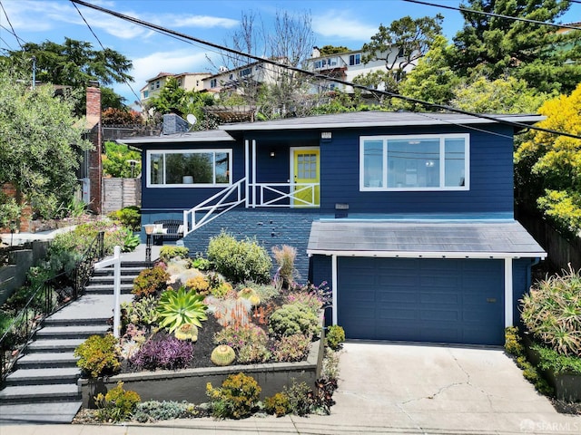 1751 Leimert Blvd, Oakland, CA 94602 - view of front of house featuring stairway, a garage, driveway, and a chimney