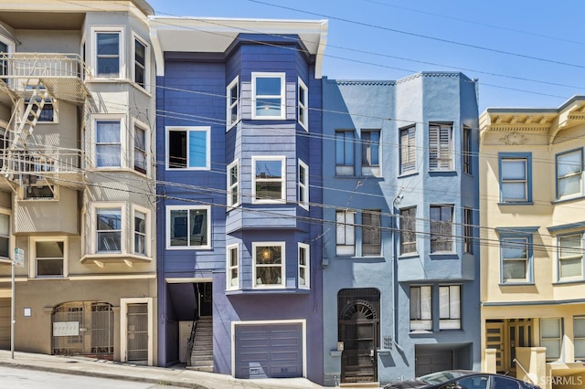 1034 Jackson St, San Francisco, CA 94133 - view of apartment building / complex with an attached garage