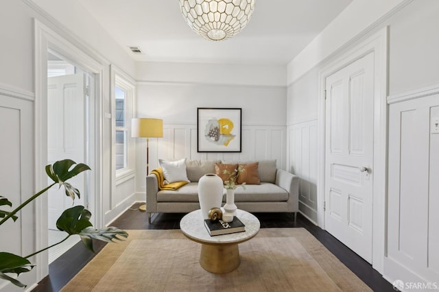 1034 Jackson St, San Francisco, CA 94133 - living area featuring a wainscoted wall, a decorative wall, and dark wood finished floors