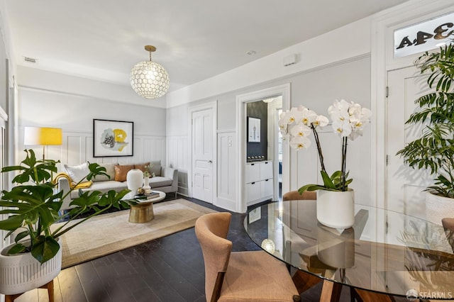 1034 Jackson St, San Francisco, CA 94133 - dining area featuring wood-type flooring, wainscoting, and a decorative wall